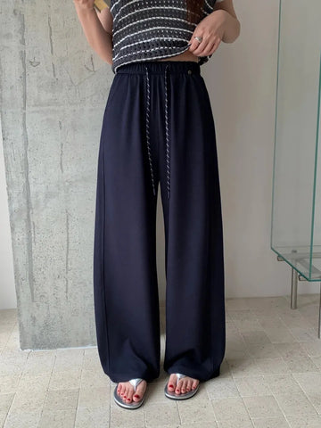 High-waisted, loose-fitting navy blue casual wide-leg pants